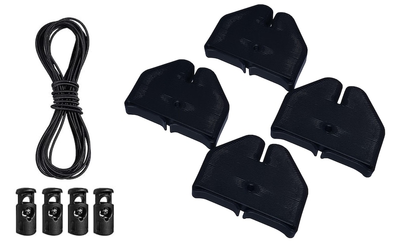 May include: A collection of black cord locks, black cord, and four black plastic cord end pieces. The cord is bundled in a loop. The cord locks are small and cylindrical.