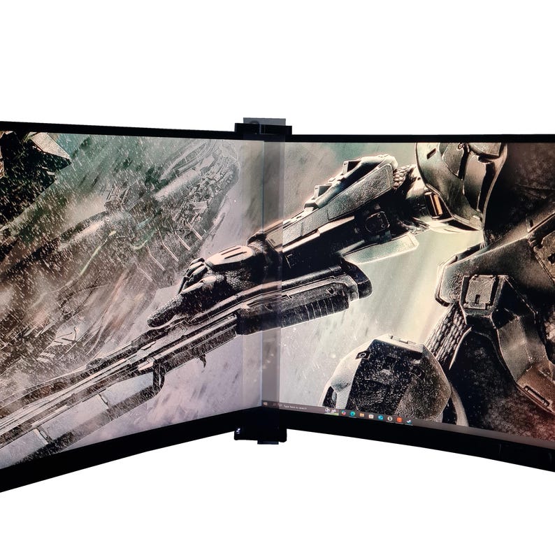 May include: A curved, dual-screen computer monitor displaying a futuristic, sci-fi scene with a soldier holding a weapon. The screens are black with a thin bezel and a small camera at the top. The image is a digital rendering.