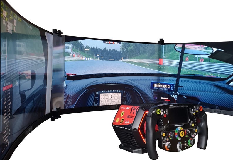 May include: A racing simulator setup featuring three curved monitors displaying a race track. A black and red Ferrari-branded steering wheel and base are in the foreground. The dashboard shows digital readouts.