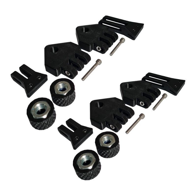 May include: An assortment of black hardware components, including brackets, nuts, bolts, and mounting pieces. The parts are arranged against a white background, showcasing their design and features. The hardware appears to be new and unused.