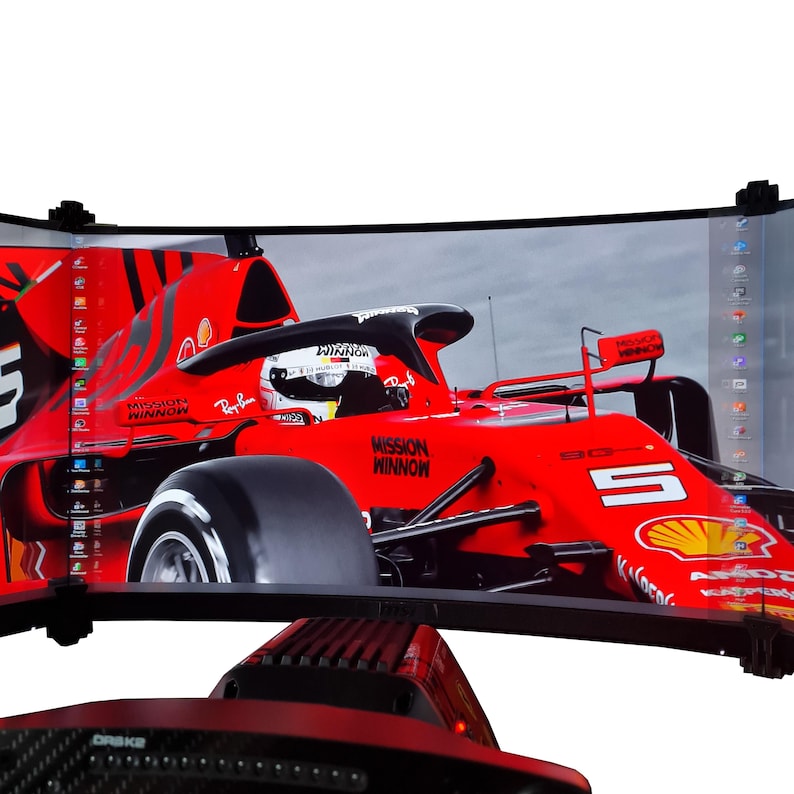 May include: Curved computer monitor displaying a red Formula 1 race car with the text "Mission Winnow" and "Ray-Ban". The monitor has a black frame and is mounted on a black base. The screen shows a race car with the number 5.