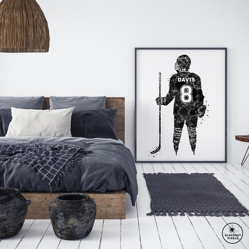 May include: Black and white illustration of a hockey player wearing a jersey with the number 8 and the name "DAVIS" on the back. The player is holding a hockey stick and is standing on a white background.