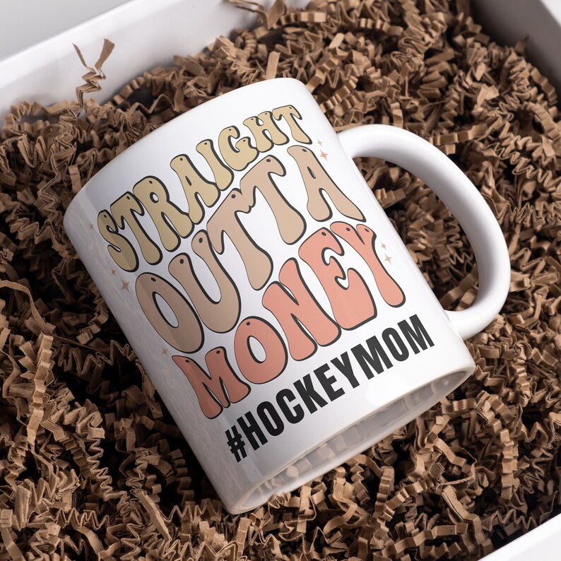 Hockey Mom 11oz Ceramic mug with graphic that says straight outta money, at the bottom it says hockey mom. This makes perfect hockey mom gifts for mothers day and a birthday, or to show your appreciation for your hockey mom, hockey coach or manager