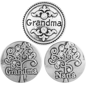 May include: Three silver-toned metal snap buttons with a tree design and rhinestones. The buttons read "Grandma" and "Nana".