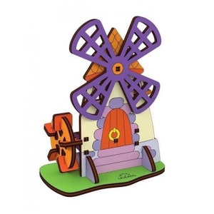 May include: A colourful wooden windmill toy with a purple and white windmill blade, a yellow roof, and a pink and orange door. The toy is on a green base with the text "U-CREATE" printed on it.