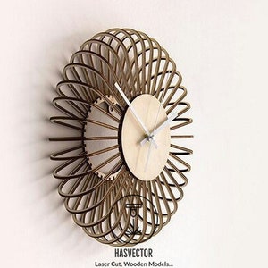 May include: A brown wooden clock with a circular face and white hands. The clock is made of thin strips of wood that are arranged in a radial pattern. The clock is mounted on a white wall. The text "HASVECTOR Laser Cut, Wooden Models..." is visible at the bottom of the image.