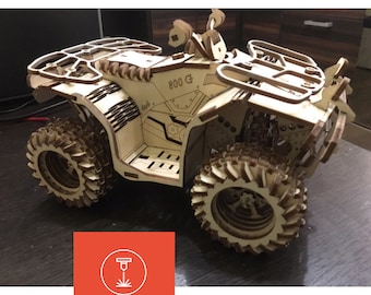 May include: A wooden model of an ATV, or all-terrain vehicle, with a detailed design and intricate details. The model is made of laser-cut wood and features a realistic design, including a roll cage, wheels, and a seat. The model is unpainted and ready to be assembled.