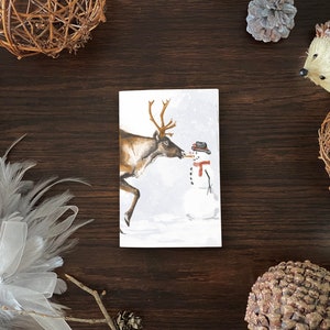 Carte de Noël de renne et de bonhomme de neige