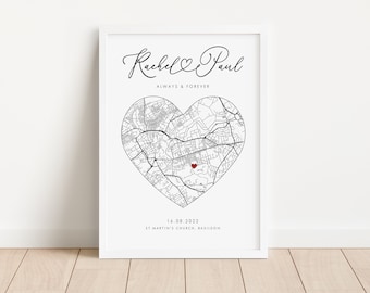 May include: A black and white map of a city in the shape of a heart with a red dot in the center. The text "Rachel & Paul" is at the top of the map, with the text "Always & Forever" below it. The date "16.08.2022" and the location "St Martin's Church, Basildon" are at the bottom of the map.