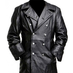 May include: A long black leather coat with a double-breasted closure and a high collar. The coat has a classic design and features silver buttons.