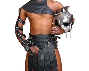 May include: A black leather gladiator costume with a matching helmet. The costume includes a leather kilt, a leather shoulder piece, and leather arm bands. The helmet is made of metal and has a spiked design.