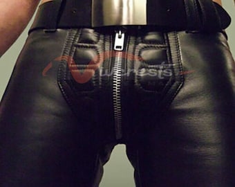 May include: Black leather pants with a zipper down the front and a belt with a silver buckle.