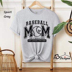 May include: A grey t-shirt with a baseball graphic and the text "Baseball Mom Like a Normal Mom But Louder & Prouder".