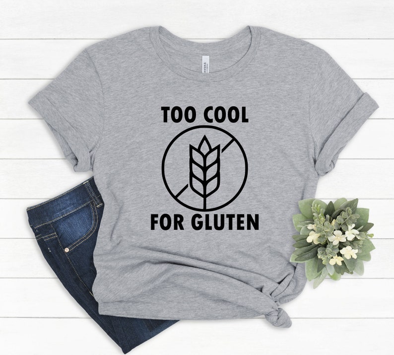 May include: Gray t-shirt with a black graphic that says "Too Cool For Gluten" with a crossed-out wheat symbol.