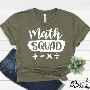 May include: A green t-shirt with the text "Math Squad" in white with plus, minus, multiply, and divide symbols below.