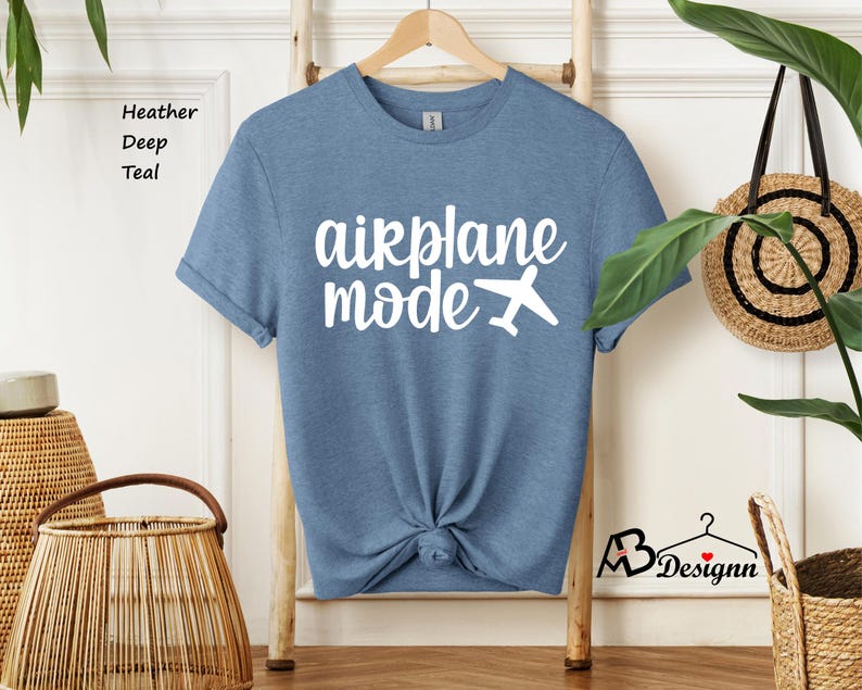 May include: A heather deep teal t-shirt with the text "airplane mode" in white with a white airplane icon.