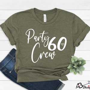 May include: A green t-shirt with the text "Party Crew 60" in white with a small heart symbol.