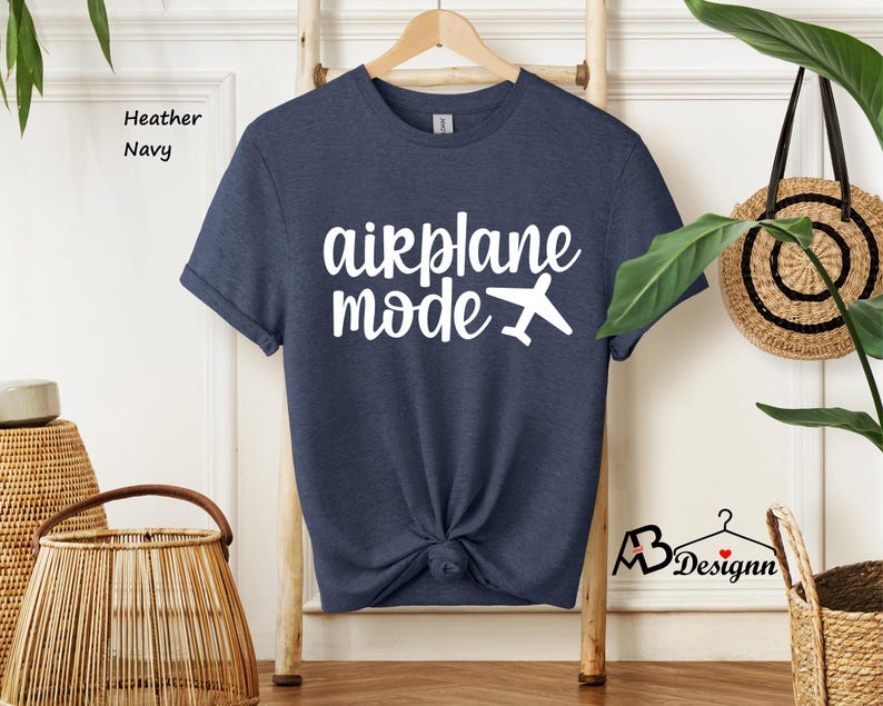 May include: A heather navy blue t-shirt with the text "airplane mode" in white with a white airplane graphic.