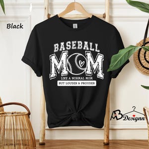 May include: Black t-shirt with a white graphic that says "Baseball Mom" with a baseball and heart design. The text below the graphic says "Like a normal mom but louder & prouder."