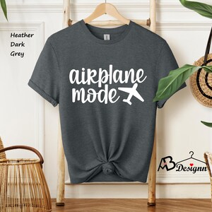 May include: A dark heather grey t-shirt with the text "airplane mode" in white lettering and a small airplane graphic.