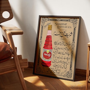 May include: Vintage poster advertising Sharbat Rooh Afza, a rose-flavored syrup. The poster features a bottle of the syrup with Urdu text describing its benefits and uses.