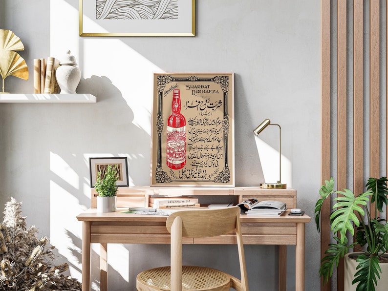 May include: A vintage poster advertising Sharbat Rodhafza, a red beverage. The poster features a bottle of the drink and Urdu text.