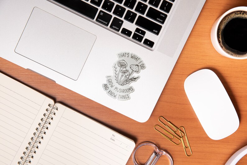 A premium 3 inch by 2 inch die-cut vinyl sticker. The sticker graphic is a black and white cluster of mushrooms with black text. The text says That's What I Do. I Grow Mushrooms And Know Things. Our stickers are waterproof/UV resistant.