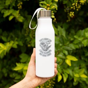 A premium 3 inch by 2 inch die-cut vinyl sticker. The sticker graphic is a black and white cluster of mushrooms with black text. The text says That's What I Do. I Grow Mushrooms And Know Things. Our stickers are waterproof/UV resistant.