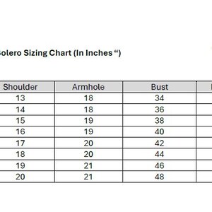 May include: A Sariling Atin bolero sizing chart table with text in inches. The table lists sizes from Small to 5XL with corresponding measurements for shoulder, armhole, bust, and lower bust in a grid format on a white background.