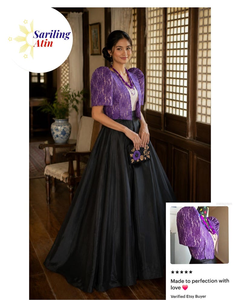 May include: A purple lace bolero jacket with structured puff sleeves worn over a white top and a long, voluminous black skirt. The outfit is accessorized with a purple beaded necklace and a small black clutch featuring a purple floral embroidery.