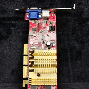 May include: A red and gold graphics card with a blue VGA port and the text "MSI" printed on the side.