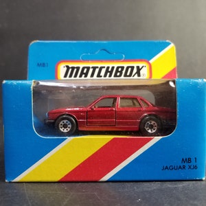 Matchbox 1/64 Escala Diecast Mb 1 Jajuar XJ6 Mettalic Red Sellado de fábrica