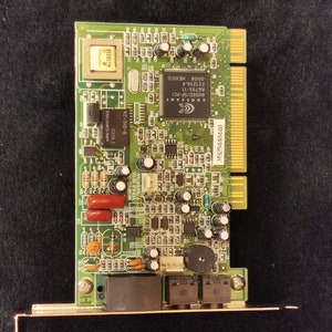 May include: A green circuit board with a chip labeled "CONEXANT RH56D/SP-PCI R6795-11 F21219.4 0008 MEXICO" and a connector labeled "M925440440".