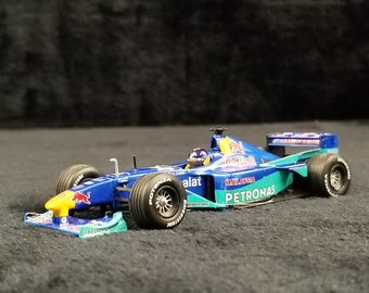 MINICHAMPS F1 1/43 Scale - 430 990082 RED BULL SAUBER PETRONAS P.DINIZ
