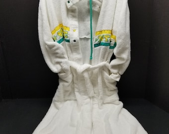 May include: White hooded bathrobe with green and yellow trim and a green drawstring. The robe has a button closure and a belt.