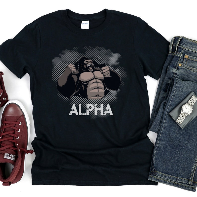 May include: Black t-shirt with a graphic of a gorilla with the word "ALPHA" printed below it.