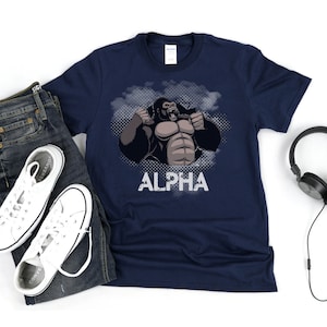 May include: Navy blue t-shirt with a graphic of a gorilla with the word "ALPHA" printed below it.