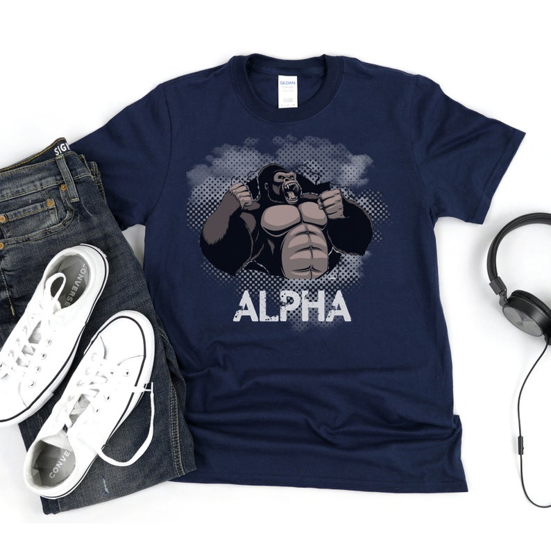 May include: Navy blue t-shirt with a graphic of a gorilla with the word "ALPHA" printed below it.