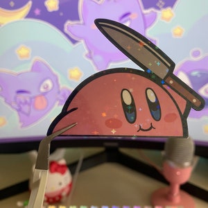 May include: A pink cartoon character with a knife sticking out of its head. The character has a happy expression and is surrounded by a purple and blue background with stars.