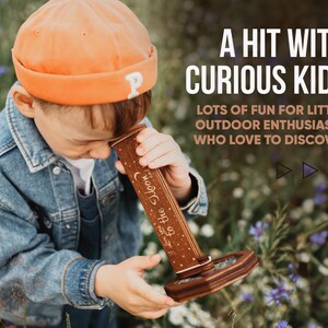 May include: A wooden kaleidoscope with a dark brown finish, featuring the engraved text "I love you to the moon and back" along with star and moon motifs. The device has a cylindrical body and a hexagonal base, designed for viewing through the top lens.
