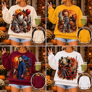 May include: A collection of four long-sleeve crewneck sweatshirts featuring horror movie character graphics. Each sweatshirt displays a unique scene with autumn foliage, pumpkins, and a specific character, paired with denim shorts and a green drink.