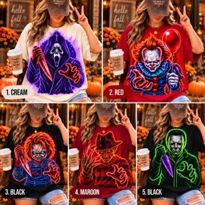 May include: A collection of five short-sleeve t-shirts featuring graphic prints of horror movie characters including Ghostface, Pennywise, Chucky, Freddy Krueger, and Michael Myers, each rendered in vibrant neon-style outlines.