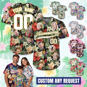 May include: A button-down baseball jersey featuring a tropical floral pattern with hibiscus flowers and palm leaves. The jersey includes customizable photo faces, the text YOUR NAME, Teamname, and the number 00 in white with gold outlines.