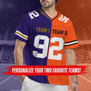 May include: A split-design V-neck jersey featuring a purple left side and an orange right side. The front displays the text TEAM 1 and TEAM 2 with the number 92 in white. The sleeves have striped detailing. A red banner across the front reads PERSONALIZE YOUR TWO FAVORITE TEAMS!