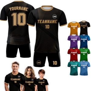 May include: Black and gold soccer jersey with a geometric pattern and the text "TEAMNAME 10" on the front. The jersey has a white collar and a logo on the chest. The jersey is shown on a model wearing black shorts with the number 10 on the leg.