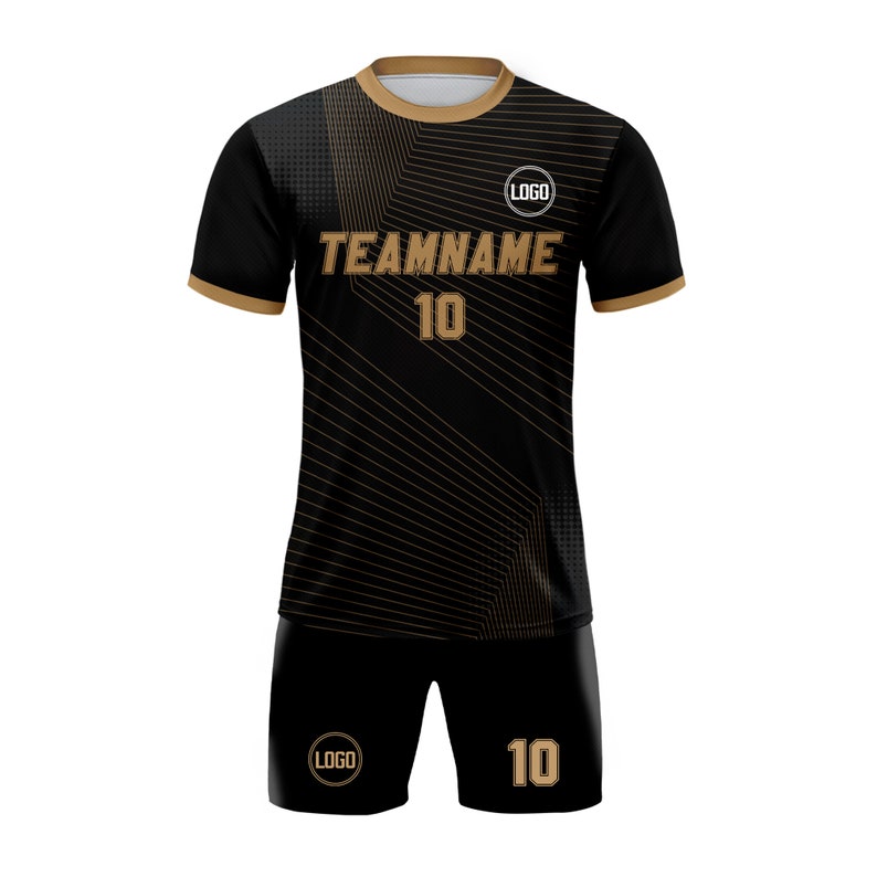 May include: Black and gold soccer jersey and shorts with a geometric pattern. The jersey has the text "TEAMNAME" and the number "10" on the front. The shorts have the number "10" on the right leg and a logo on the left leg.