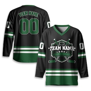May include: Black hockey jersey with green and white accents. The jersey features the text "YOUR NAME" and the number "00" on the back. The front displays a hockey-themed logo with the text "TEAM NAME".