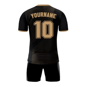 May include: Black and gold soccer jersey with a geometric pattern and the number 10 on the back. The text "YOURNAME" is above the number.