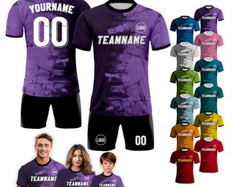 May include: A purple and black soccer jersey with the text "TEAMNAME" and "LOGO" on the front. The jersey has a geometric pattern and is shown with matching shorts. The image also shows a variety of other soccer jerseys in different colors.