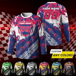 May include: Long-sleeved jersey with a blue, red, and white design. The jersey features the text "YOUR NAME" and the number "00" on the front and back. The sleeves have "CUSTOMTEXT" printed on them. The image also shows the jersey in various color options.